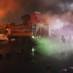 
              Firefighters work to contain a fire that broke out at the BM Inland Container Depot, a Dutch-Bangladesh joint venture, in Chittagong, 216 kilometers (134 miles) southeast of capital, Dhaka, Bangladesh, early Sunday, June 5, 2022. Several people were killed and more than 100 others were injured in the fire the cause of which could not be immediately determined. (AP Photo)
            