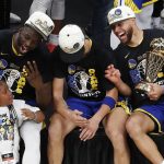 
              Golden State Warriors guard Stephen Curry, right, forward Draymond Green, left, and Golden State Warriors guard Klay Thompson celebrate after defeating the Boston Celtics in Game 6 to win basketball's NBA Finals championship, Thursday, June 16, 2022, in Boston. (AP Photo/Michael Dwyer)
            