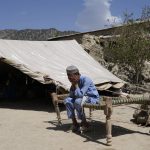 
              Afghan boy sits in a courtyard of her destroyed home after an earthquake in Gayan district in Paktika province, Afghanistan, Sunday, June 26, 2022. A powerful earthquake struck a rugged, mountainous region of eastern Afghanistan early Wednesday, flattening stone and mud-brick homes in the country's deadliest quake in two decades, the state-run news agency reported. (AP Photo/Ebrahim Nooroozi)
            