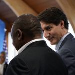
              Canada's Prime Minister Justin Trudeau, right, talks with South Africa's President Cyril Ramaphosa, left, before the start of a lunch with the Group of Seven leaders at the Schloss Elmau hotel in Elmau, Germany, Monday, June 27, 2022, during the annual G7 summit. Joining the Group of Seven are guest country leaders and heads of international organizations. (AP Photo/Susan Walsh, Pool)
            