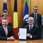 
              Australian Prime Minister Anthony Albanese, front right, and Australian Minister for Climate Change Chris Bowen pose for photographs after signing the Nationally Determined Contribution to a cut in emissions by 2030 at Parliament House in Canberra, Australia, Thursday, June 16, 2022. Australia’s new government on Thursday formally committed to a more ambitious greenhouse gas reduction target of 43% by the end of the decade in fulfillment of a key election pledge. (Lukas Coch/AAP Image via AP)
            