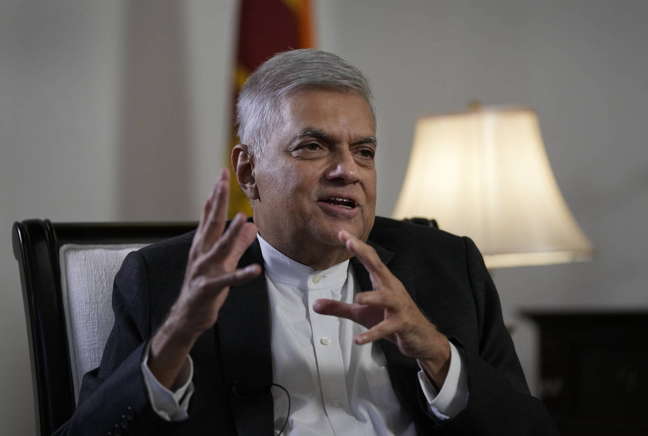 Sri Lanka's new prime minister Ranil Wickremesinghe gestures during an interview with The Associate...