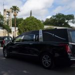 
              Two hearses carrying the bodies of Irma Garcia, a school teacher who was killed in last week's elementary school shooting, and her husband, Joe, arrive at Sacred Heart Catholic Church in Uvalde, Texas, Wednesday, June 1, 2022. (AP Photo/Jae C. Hong)
            