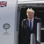 
              Britain's Prime Minister Boris Johnson steps out of a plane on arrival at the Torreon air base in Madrid, Spain, Tuesday June 28, 2022. North Atlantic Treaty Organization heads of state will meet for a NATO summit in Madrid from Tuesday through Thursday. (J.J.Guillen/Pool photo via AP)
            