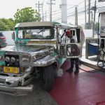 
              A passenger jeepney driver refuels his vehicle at a gasoline station in Quezon City, Philippines on Monday, June 20, 2022. Around the world, drivers are looking at numbers on the gas pump and rethinking their habits and finances. (AP Photo/Aaron Favila)
            