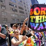 
              Spectators cheer on as revelers march down Fifth Avenue during the annual NYC Pride March, Sunday, June 26, 2022, in New York. (AP Photo/Mary Altaffer)
            