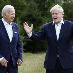 
              US President Joe Biden and Britain's Prime Minister Boris Johnson, right, chat as they gather for a group photo at Castle Elmau in Kruen, near Garmisch-Partenkirchen, Germany, on Sunday, June 26, 2022. The Group of Seven leading economic powers are meeting in Germany for their annual gathering Sunday through Tuesday. (Brendan Smialowski/Pool via AP)
            