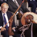
              British Prime Minister Boris Johnson, left, and Rwandan President Paul Kagame, right, look at traditional dancers performing during the opening ceremony of the Commonwealth Heads of Government Meeting (CHOGM) on Friday, June 24, 2022 in Kigali, Rwanda. Leaders of Commonwealth nations are meeting in Rwanda Friday in a summit that promises to tackle climate change, tropical diseases and other challenges deepened by the COVID-19 pandemic. (Dan Kitwood/Pool Photo via AP)
            