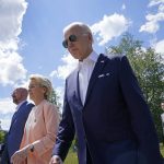 
              President Joe Biden, right, walks with European Commission President Ursula von der Leyen, center, and European Council President Charles Michel, left, as they head to a family photo with the G7 leaders at the G7 Summit in Elmau, Germany, Sunday, June 26, 2022. (AP Photo/Susan Walsh, Pool)
            