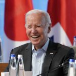 
              President Joe Biden smiles as he waits for the start of a lunch with the Group of Seven leaders at the Schloss Elmau hotel in Elmau, Germany, Monday, June 27, 2022, during the annual G7 summit. Joining the Group of Seven are guest country leaders and heads of international organizations. (AP Photo/Susan Walsh, Pool)
            