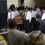 
              The caskets for Irma Garcia and husband Joe Garcia are carried by pallbearers following a joint service at Sacred Heart Catholic Church, Wednesday, June 1, 2022, in Uvalde, Texas. Irma Garcia was killed in last week's elementary school shooting; Joe Garcia died two days later. (AP Photo/Eric Gay)
            