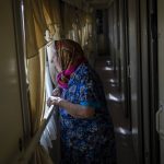 
              An elderly woman who has been evacuated from the Lysychansk area look out the window of an evacuation train in Pokrovsk in eastern Ukraine, Friday, June 10, 2022. (AP Photo/Bernat Armangue )
            