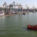 
              A Russian vessel, top left, prepares to depart from the Mariupol Sea Port in Mariupol, in territory under the government of the Donetsk People's Republic, eastern Ukraine, Tuesday, May 31, 2022. It marked the first time that a commercial ship used the port of Mariupol since the start of the Russian military action in Ukraine. (AP Photo)
            