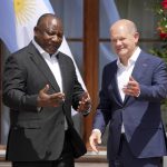 
              German Chancellor Olaf Scholz, right, greets South Africa's President Cyril Ramaphosa during the official welcome ceremony of G7 leaders and Outreach guests at Castle Elmau in Kruen, near Garmisch-Partenkirchen, Germany, on Monday, June 27, 2022. The Group of Seven leading economic powers are meeting in Germany for their annual gathering Sunday through Tuesday. (AP Photo/Matthias Schrader)
            