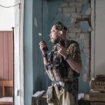 
              A Ukrainian soldier holds radios during heavy fighting on the front line in Severodonetsk, the Luhansk region, Ukraine, Wednesday, June 8, 2022. (AP Photo/Oleksandr Ratushniak)
            