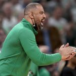 
              Boston Celtics coach Ime Udoka encourages his players during the fourth quarter of Game 4 of basketball's NBA Finals against the Golden State Warriors, Friday, June 10, 2022, in Boston. (AP Photo/Steven Senne)
            