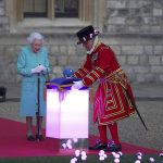 
              Queen Elizabeth II arrives to symbolically lead the lighting of the principal Jubilee beacon in Windsor, England, Thursday June 2, 2022, on day one of the Platinum Jubilee celebrations. Over 1500 towns, villages and cities throughout the UK, Channel Islands, Isle of Man and UK Overseas Territories will come together to light a beacon to mark the Jubilee. The events over a long holiday weekend in the U.K. are meant to celebrate the monarch’s 70 years of service. (Steve Parsons/Pool via AP)
            