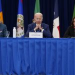 
              President Joe Biden, center, attends a meeting with leaders of Caribbean nations beside Suriname President Chandrikapersad Santokhi, left, and Vice President Kamala Harris, right, during the Summit of the Americas, Thursday, June 9, 2022, in Los Angeles. (AP Photo/Evan Vucci)
            