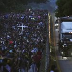 
              Migrants, many from Central American and Venezuela, walk along the Huehuetan highway in Chiapas state, Mexico, early Tuesday, June 7, 2022. The group left Tapachula on Monday, tired of waiting to normalize their status in a region with little work and still far from their ultimate goal of reaching the United States. (AP Photo/Marco Ugarte)
            
