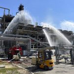 
              In this handout photo released by Russian Emergency Ministry Press Service, Russian Emergency Situation ministry's firefighters work at the scene of a fire at the Novoshakhtinsk oil processing plant in the Rostov-on-Don region in Russia, Wednesday, June 22, 2022. A drone strike caused a fire at a refinery in southwestern Russia near the border with Ukraine on Wednesday, but no one was hurt and the blaze was contained quickly, officials said. (Russian Emergency Ministry Press Service via AP)
            