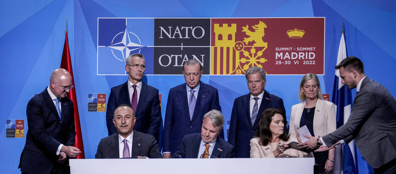 From left to right background: NATO Secretary General Jens Stoltenberg, Turkish President Recep Tay...