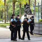 
              Police officers stand guard at the Hong Kong's Victoria Park, Saturday, June 4, 2022. Dozens of police officers patrolled Hong Kong's Victoria Park on Saturday after authorities for a second consecutive third banned public commemoration of the anniversary of the Tiananmen Square crackdown in 1989, amid a crackdown on dissent in the city. (AP Photo/Kin Cheung)
            