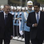 
              Venezuela's President Nicolas Maduro, right, reviews a military honour guard with Turkish President Recep Tayyip Erdogan during a welcome ceremony, in Ankara, Turkey, Wednesday, June 8, 2022. (AP Photo/Burhan Ozbilici)
            