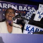 
              FILE - Rep. Karen Bass, D-Calif., speaks during her election night party Tuesday, June 7, 2022, in Los Angeles. In L.A., Rick Caruso positioned himself as an outsider challenging the city's progressive establishment amid an unabated homeless crisis, soaring rents and home prices and worries over crime. He was running first in preliminary returns and will face Bass, a stalwart in the party's progressive wing, in a November runoff that will bring a stark contrast to voters. (AP Photo/John McCoy, File)
            