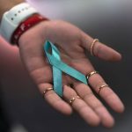 
              Sarah Barber shows a ribbon given to her by sexual abuse survivors at the Southern Baptist Convention’s annual meeting in Anaheim, Calif., Tuesday, June 14, 2022. (AP Photo/Jae C. Hong)
            