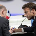
              French President Emmanuel Macron speaks with Germany's Chancellor Olaf Scholz at the start of the second plenary session of the NATO summit in Madrid, Wednesday, June 29, 2022. North Atlantic Treaty Organization heads of state will meet for a NATO summit in Madrid from Tuesday through Thursday. (Eliot Blondet, Pool via AP)
            