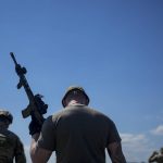 
              A civilian militia man holds a rifle during training at a shooting range in outskirts Kyiv, Ukraine, Tuesday, June 7, 2022. (AP Photo/Natacha Pisarenko)
            