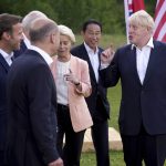 
              British Prime Minister Boris Johnson, right, speaks with, from left, European Council President Charles Michel, Canada's Prime Minister Justin Trudeau, French President Emmanuel Macron, U.S. President Joe Biden, German Chancellor Olaf Scholz, European Commission President Ursula von der Leyen and Japan's Prime Minister Fumio Kishida and European Commission President Ursula von der Leyen after the official G7 group photo at Castle Elmau in Kruen, near Garmisch-Partenkirchen, Germany, on Sunday, June 26, 2022. The Group of Seven leading economic powers are meeting in Germany for their annual gathering Sunday through Tuesday. (AP Photo/Matthias Schrader)
            