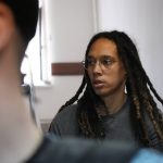 
              WNBA star and two-time Olympic gold medalist Brittney Griner is escorted to a courtroom for a hearing, in Khimki just outside Moscow, Russia, Monday, June 27, 2022. More than four months after she was arrested at a Moscow airport for cannabis possession, American basketball star Brittney Griner is to appear in court Monday for a preliminary hearing ahead of her trial. (AP Photo/Alexander Zemlianichenko)
            