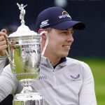 
              Matthew Fitzpatrick, of England, poses with the trophy after winning the U.S. Open golf tournament at The Country Club, Sunday, June 19, 2022, in Brookline, Mass. (AP Photo/Julio Cortez)
            