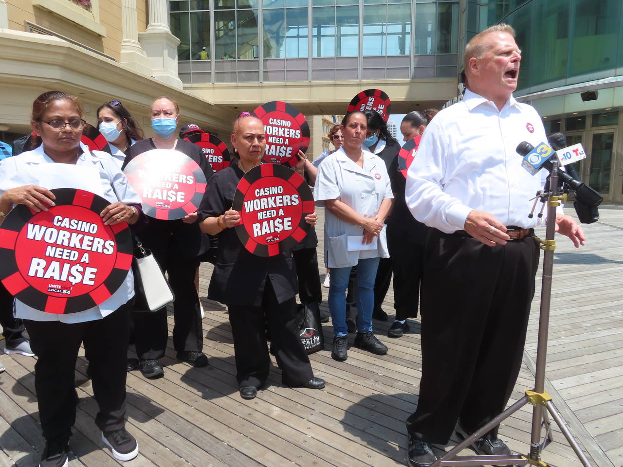 Bob McDevitt, left, president of Local 54 of the Unite here union, speaks at a press conference on ...