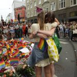 
              Two women embrace each other as they lay flowers at the scene of a shooting in central Oslo, Norway, Saturday, June 25, 2022. A gunman opened fire in Oslo’s night-life district early Saturday, killing two people and leaving more than 20 wounded in what Norwegian security service called an "Islamist terror act" during the capital’s annual Pride festival. (AP Photo/Sergei Grits)
            