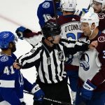 
              Linesman Steve Barton (59) separates Tampa Bay Lightning left wing Pierre-Edouard Bellemare (41) and Colorado Avalanche defenseman Jack Johnson (3) during the second period of Game 6 of the NHL hockey Stanley Cup Finals on Sunday, June 26, 2022, in Tampa, Fla. (AP Photo/John Bazemore)
            
