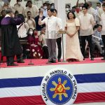 
              President-elect Ferdinand "Bongbong" Marcos Jr. is sworn in by Supreme Court Chief Justice Alexander Gesmundo during the inauguration ceremony at National Museum on Thursday, June 30, 2022 in Manila, Philippines. Marcos was sworn in as the country's 17th president. (AP Photo/Aaron Favila)
            