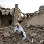 
              An Afghan sits by the rubble of his house earthquake in Gayan village, in Paktika province, Afghanistan, Thursday, June 23, 2022. A powerful earthquake struck a rugged, mountainous region of eastern Afghanistan early Wednesday, flattening stone and mud-brick homes in the country's deadliest quake in two decades, the state-run news agency reported. (AP Photo/Ebrahim Nooroozi)
            