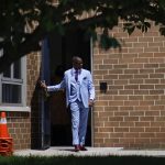
              Rev. Dante Quick, exits the First Baptist Church of Lincoln Gardens after preaching during a church service on Sunday, May 22, 2022, in Somerset, N.J. (AP Photo/Eduardo Munoz Alvarez)
            