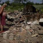 
              A man looks at what is left of his home and car after attacks in Yasnohorodka, on the outskirts of Kyiv, Ukraine, Wednesday, June 8, 2022. (AP Photo/Natacha Pisarenko)
            