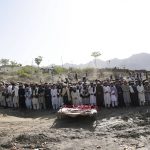 
              Afghans pray for relatives killed in an earthquake to a burial site l in Gayan village, in Paktika province, Afghanistan, Thursday, June 23, 2022. A powerful earthquake struck a rugged, mountainous region of eastern Afghanistan early Wednesday, flattening stone and mud-brick homes in the country's deadliest quake in two decades, the state-run news agency reported. (AP Photo/Ebrahim Nooroozi)
            