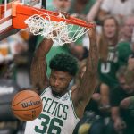
              Boston Celtics guard Marcus Smart (36) dunks the ball against the Golden State Warriors during the third quarter of Game 4 of basketball's NBA Finals, Friday, June 10, 2022, in Boston. (AP Photo/Steven Senne)
            