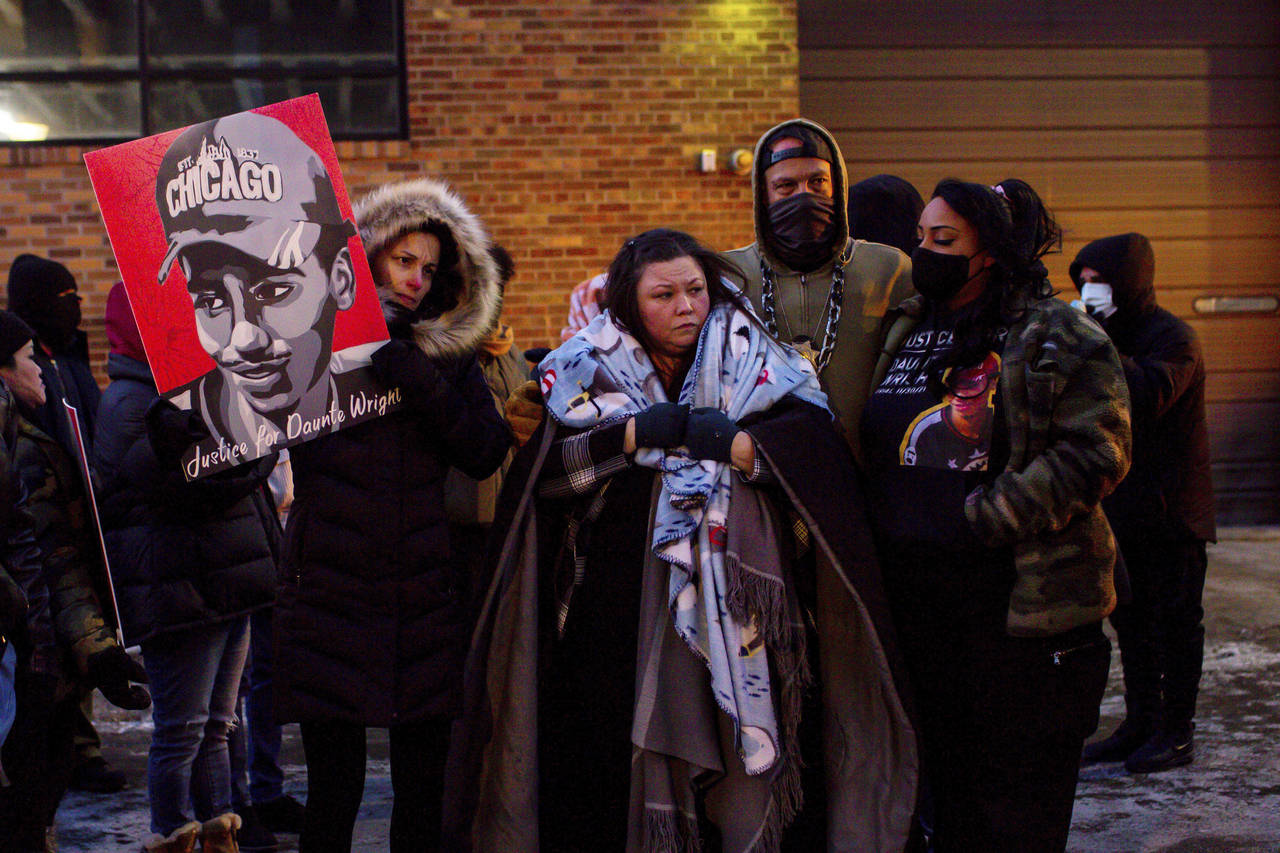 FILE - Katie Bryant, Daunte Wright's mother, is surrounded by community members and activists at th...