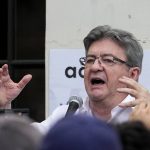 
              Hard-left leader Jean-Luc Melenchon speaks to supporters outside his election night headquarters, Sunday, June 19, 2022 in Paris. French President Emmanuel Macron's alliance got the most seats in the final round of the parliamentary election on Sunday, but it lost its parliamentary majority, projections show. (AP Photo/Michel Euler)
            