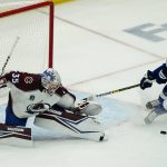 
              Colorado Avalanche goaltender Darcy Kuemper (35) deflects shot by Tampa Bay Lightning center Steven Stamkos (91) during the first period of Game 6 of the NHL hockey Stanley Cup Finals on Sunday, June 26, 2022, in Tampa, Fla. (AP Photo/John Bazemore)
            