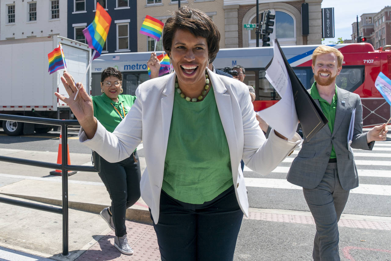 District of Columbia Mayor Muriel Bowser, center, arrives for a news conference ahead of DC Pride e...