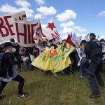 
              Police scuffle with protestors during a demonstration ahead of the G7 meeting in Munich, Germany, Saturday, June 25, 2022. The G7 Summit will take place at Castle Elmau near Garmisch-Partenkirchen from June 26 through June 28, 2022. (AP Photo/Martin Meissner)
            