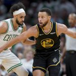 
              Golden State Warriors guard Stephen Curry (30) drives against Boston Celtics guard Derrick White (9) during the second quarter of Game 4 of basketball's NBA Finals, Friday, June 10, 2022, in Boston. (AP Photo/Steven Senne)
            