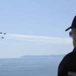 
              In this handout photo provided by the Turkish Presidency, Turkish President Recep Tayyip Erdogan watches jet fighters fly past during the final day of military exercises that were taking place in Seferihisar near Izmir, on Turkey's Aegean coast, Thursday, June 9, 2022. Erdogan on Thursday warned Greece to demilitarize islands in the Aegean, saying he was "not joking" with such comments. Turkey says Greece has been building a military presence on Aegean in violation of treaties that guarantee the unarmed statues of the islands. (Turkish Presidency via AP)
            